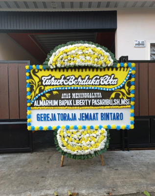 Papan Bunga Duka di Kayu Kapur